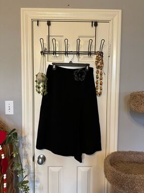 Classic Black A-Line Skirt with Floral Brooch